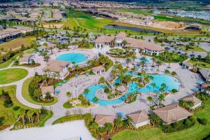 an aerial view of a resort with two pools at Gorgeous 2BR with Waterpark & 2 Clubhouses in Kissimmee
