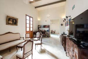 TV a/nebo společenská místnost v ubytování Villa Orquídea Boutique Hotel