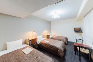 Кровать или кровати в номере Sunny Stone Hotel
