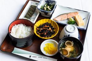 a tray of food with rice and other foods at Sunny Stone Hotel in Osaka