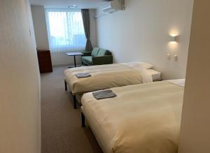Katil atau katil-katil dalam bilik di Hotel Crown Hills Kushiro