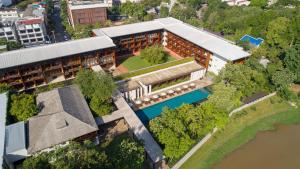 an overhead view of a building with a river at Anantara Chiang Mai Resort in Chiang Mai