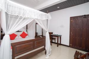 Shirantha Hotel客房内的一张或多张床位