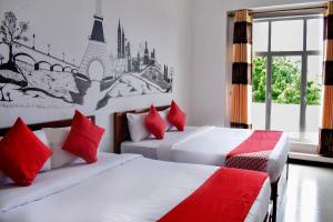 Voodi või voodid majutusasutuse Mallika Resort toas