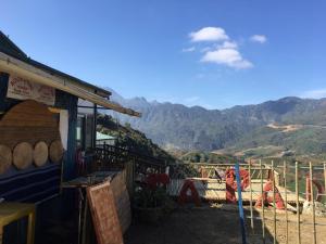 a building with a view of a mountain at Sapa Dao Homestay in Sa Pa