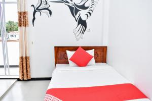 Voodi või voodid majutusasutuse Mallika Resort toas