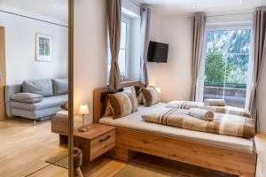 Rúm í herbergi á Pension Waldhauser