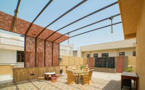 an outdoor patio with a table and chairs at R41-A Boutique Hotel in Jaipur