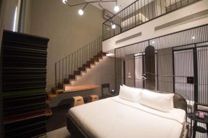 Tempat tidur dalam kamar di MOV Hotel Kuala Lumpur
