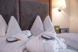 Postel nebo postele na pokoji v ubytování Hotel Dosses