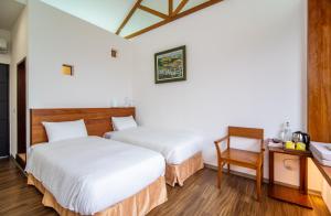 Rúm í herbergi á 逢春園Feng Chun Villa