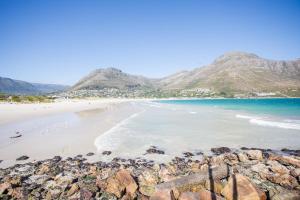 a view of a beach with mountains in the background at dk villas 2 The Boardwalk (Hout Bay) in Hout Bay