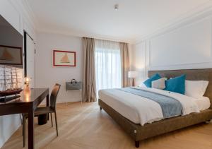 Postel nebo postele na pokoji v ubytování Porto Romano - The Marina Resort