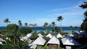 a view of the ocean from a resort at Thanya Beach Resort - SHA Plus in Ko Ngai