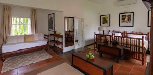 a living room with a bed and a window at Nyne Hotels - Rock Villa, Bentota in Bentota