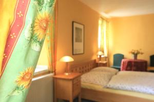 Postel nebo postele na pokoji v ubytování Hotel Weingewolbe