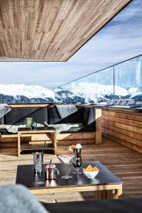 a room with a table and a bed on a boat at Mountain View in Kaltenbach