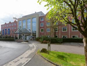 a large building with a street in front of it at Essential by Dorint Remscheid in Remscheid
