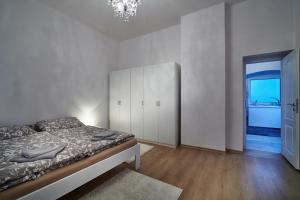 Posteľ alebo postele v izbe v ubytovaní Apartmán BB centrum