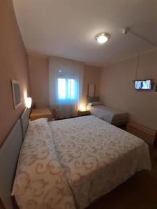 Postel nebo postele na pokoji v ubytování Albergo Centrale