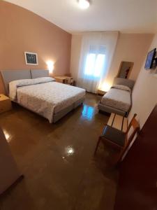 Postel nebo postele na pokoji v ubytování Albergo Centrale