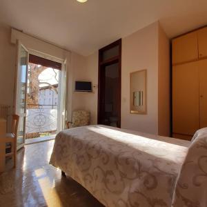 Tempat tidur dalam kamar di Albergo Centrale