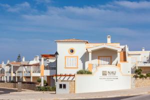 a rendering of a villa in a residential neighbourhood at NAU Salema Beach Village in Salema