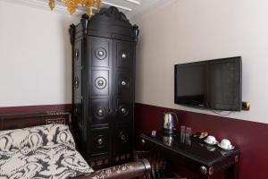 a room with a bed and a dresser at Premist Hotels Sultanahmet in Istanbul