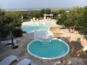 Bazén v ubytování Corte Di Ferro Hotel & Wellness Resort nebo v jeho okolí