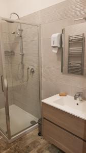 a bathroom with a shower and a sink at THAT'S AMORE FIUMICINO Airport in Fiumicino