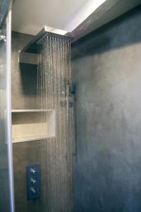 a shower in a bathroom with a shower at Wood Stone and Wine in Beaune