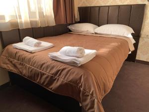 A bed or beds in a room at Guest house VRAZHDEBNA