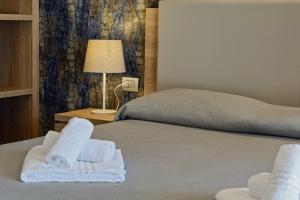 
Letto o letti in una camera di Hotel Serenella
