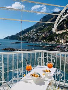 a table with plates of food on a cruise ship at Hotel Marina Riviera in Amalfi