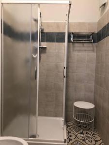 a shower with a glass door in a bathroom at LA DAMA ROOM&BREAKFAST in Russi