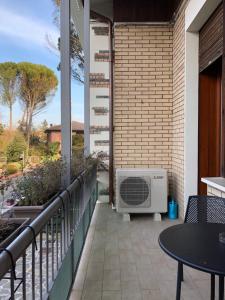 a balcony with a heater on the side of a building at LA DAMA ROOM&BREAKFAST in Russi