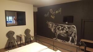 A bed or beds in a room at Mama Muh Self-Check-in