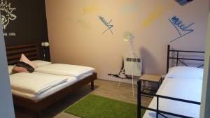 A bed or beds in a room at Mama Muh Self-Check-in