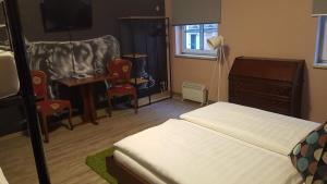 A bed or beds in a room at Mama Muh Self-Check-in