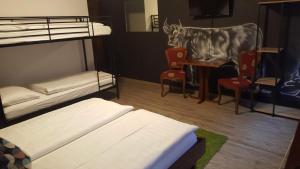 A bed or beds in a room at Mama Muh Self-Check-in
