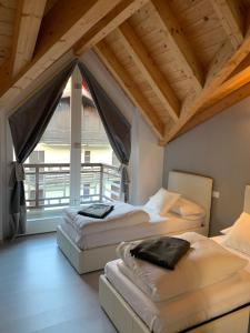 Postel nebo postele na pokoji v ubytování Alpin Sky