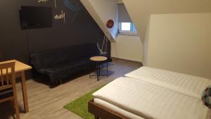 A bed or beds in a room at Mama Muh Self-Check-in