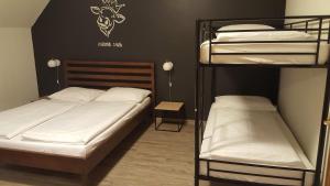 A bed or beds in a room at Mama Muh Self-Check-in