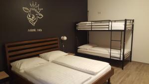 A bed or beds in a room at Mama Muh Self-Check-in