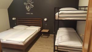 A bed or beds in a room at Mama Muh Self-Check-in