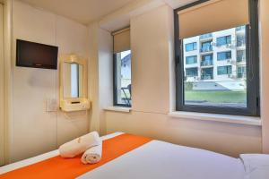 Postel nebo postele na pokoji v ubytování easyHotel Sofia