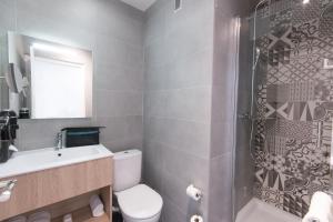 Koupelna v ubytování Hotel Aria
