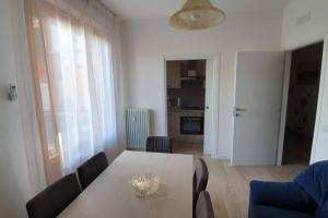a dining room with a table and chairs at Appartamento Gioele in Prato