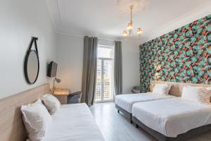 Postel nebo postele na pokoji v ubytování Hotel Aria