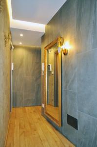 a bathroom with a mirror and a walk in shower at Epoca in Sila in Camigliatello Silano